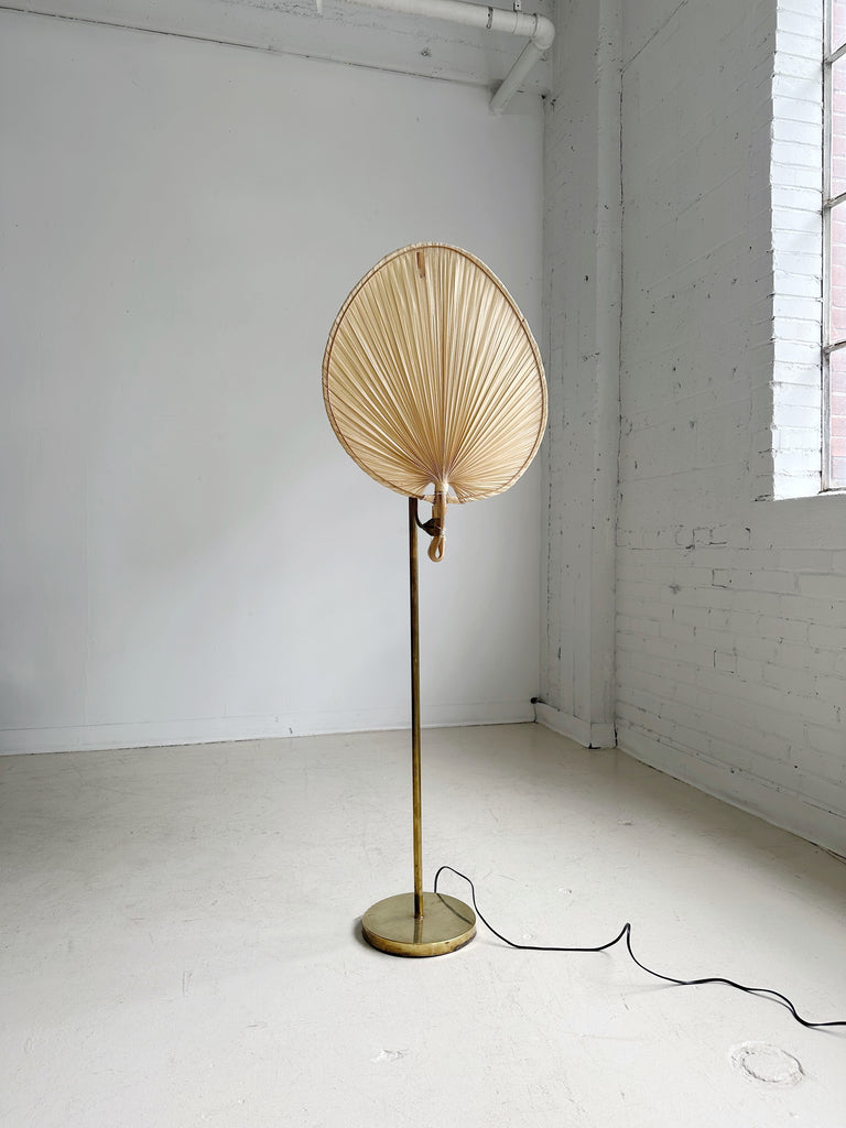 BRASS FLOOR LAMP WITH PALM LEAF SHADE IN THE STYLE OF INGO MAURER