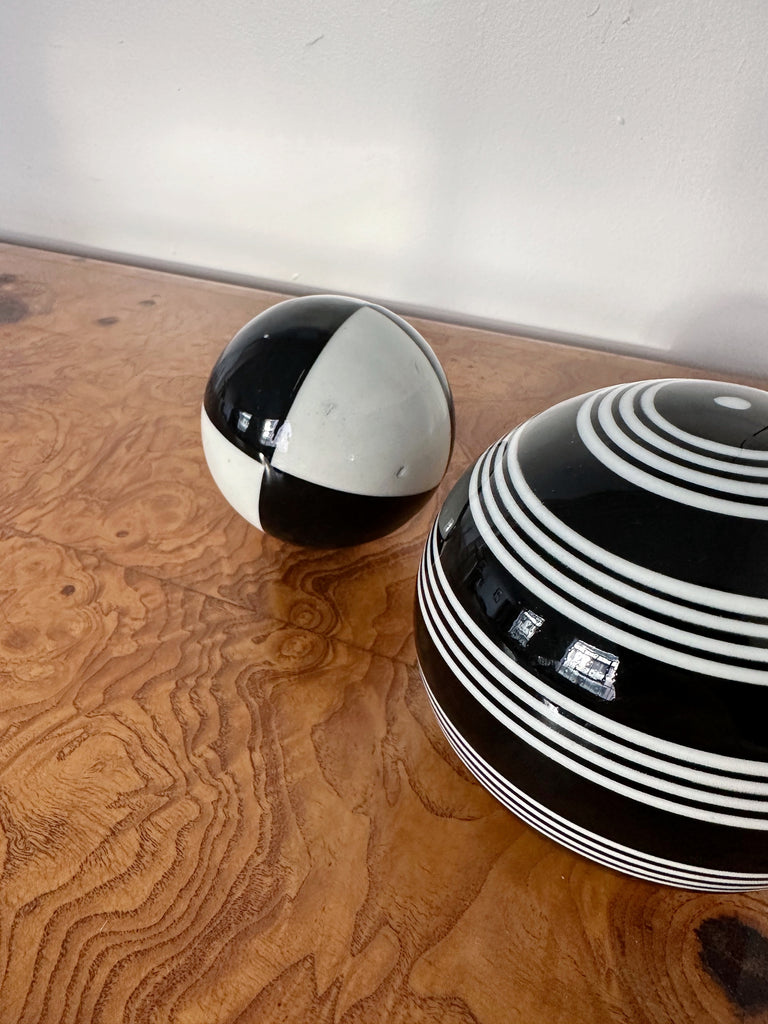 PAIR OF BLACK & WHITE CERAMIC SPHERES