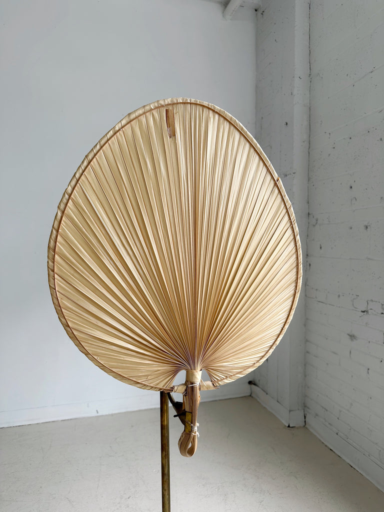 BRASS FLOOR LAMP WITH PALM LEAF SHADE IN THE STYLE OF INGO MAURER