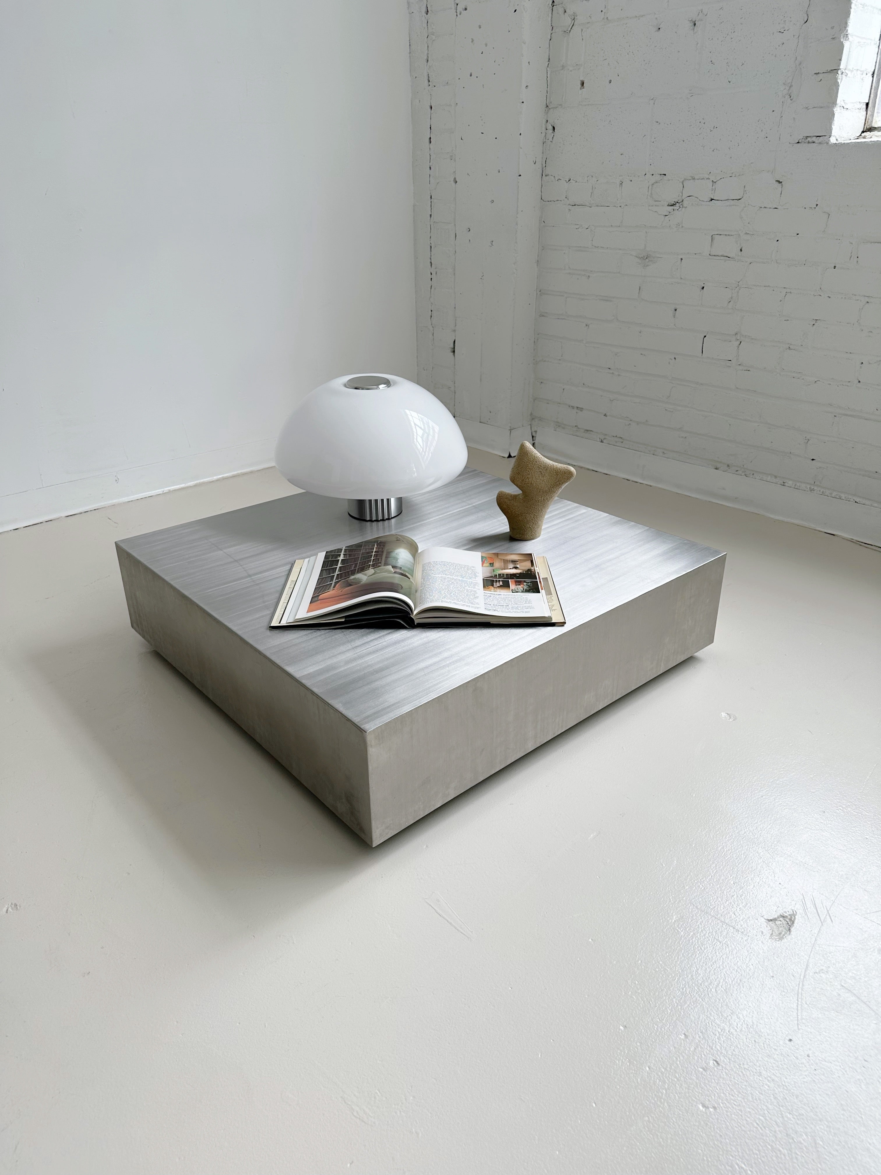 STAINLESS STEEL LOW COFFEE TABLE | Maison Singulier