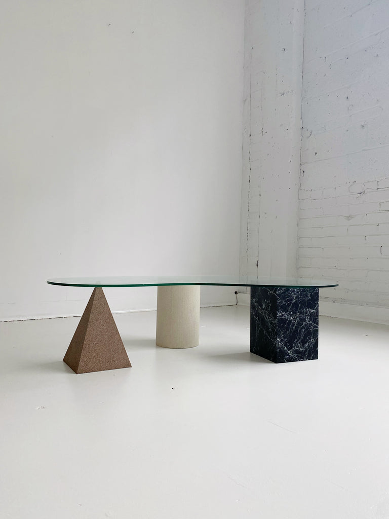 GEOMETRIC FAUX STONE COFFEE TABLE WITH BEAN GLASS TOP