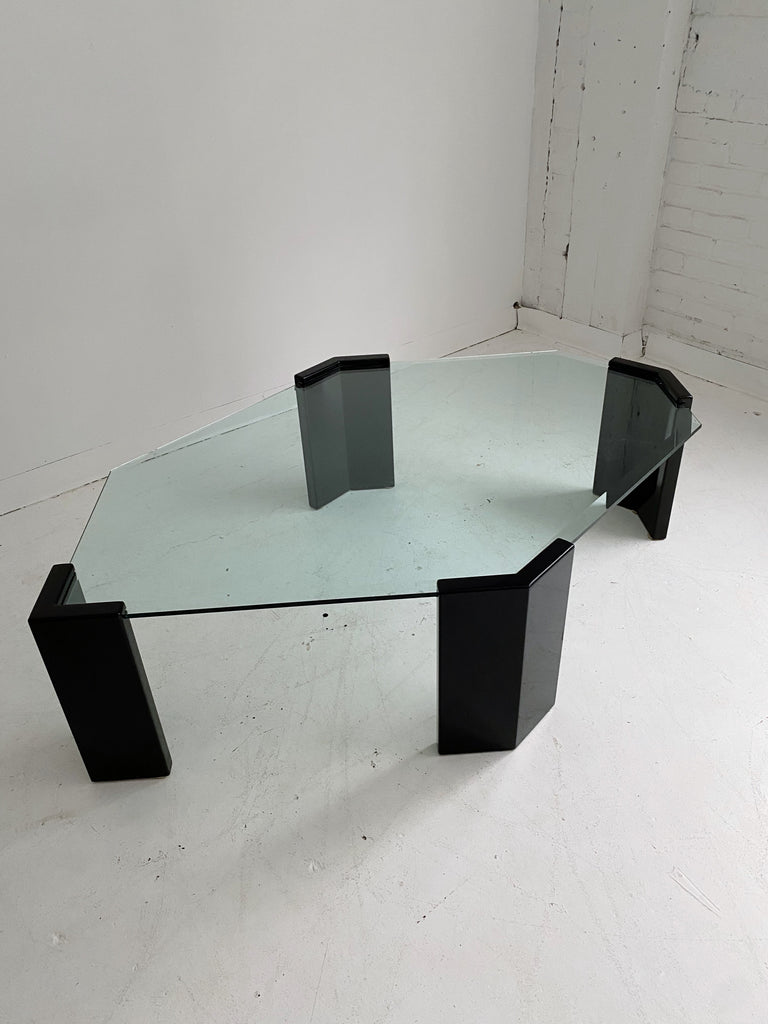 TRAPEZOID GLASS COFFEE TABLE WITH LACQUERED BLACK LEGS