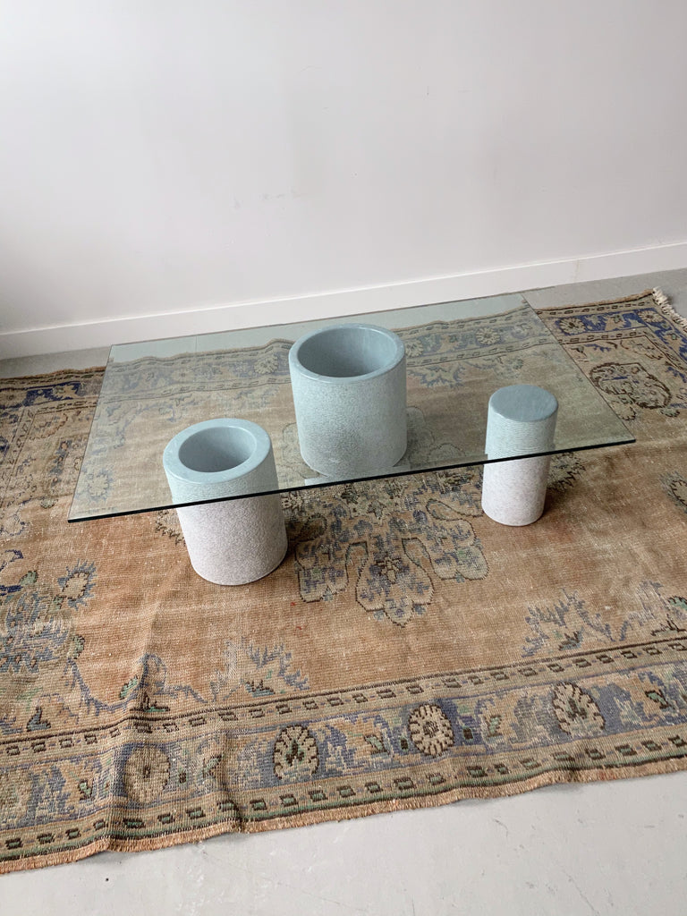 GLASS COFFEE TABLE WITH CYLINDRICAL CEMENT BASE