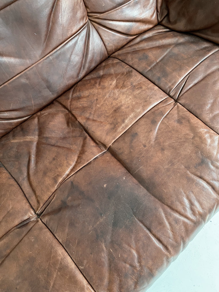 BROWN LEATHER LOVESEAT WITH WOODEN FRAME